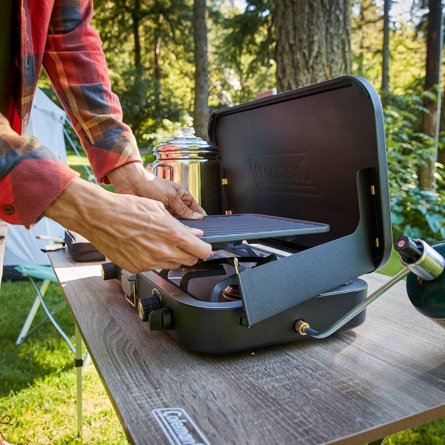 imageColeman 1900 Collection 3in1 Propane Camping Stove Cast Iron Grill ampamp Griddle Accessories Included 24000 BTUs Across 2 Adjustable Burners with Wind Guards ampamp Matchless Lighting